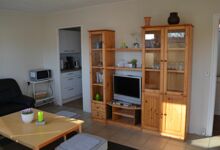 Wohnzimmer mit Blick in die Küche Ferienhaus Zum Anleger 18 in Hohen Wieschendorf