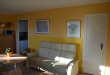 Wohnzimmer mit Blick zur Küche Ferienhaus Zum Anleger 24 in Hohen Wieschendorf